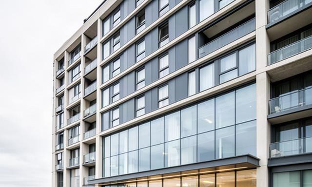 Modern Newcastle apartment building with shared entrance glazing and several levels of windows