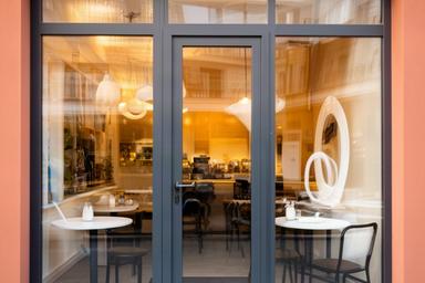Cafe frontage with clean clear windows ready for customers arriving in the morning